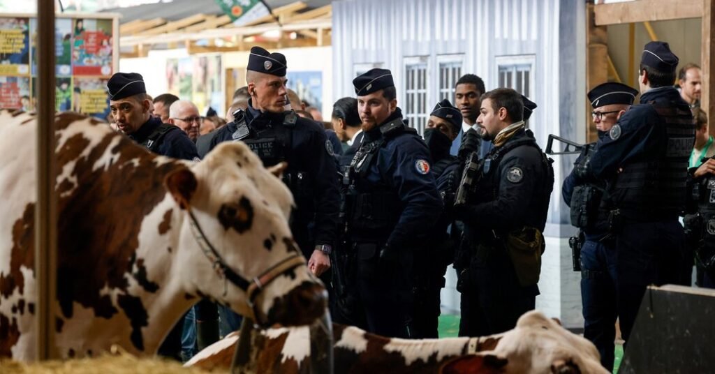 Farmers Clash With Police And Macron At Paris Agricultural Fair